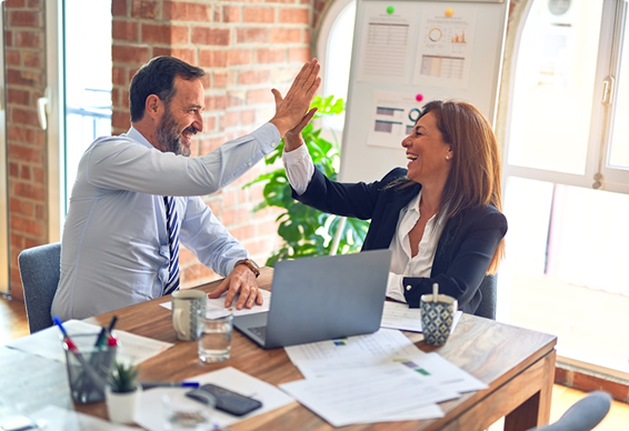 co-workers discussing happily in office